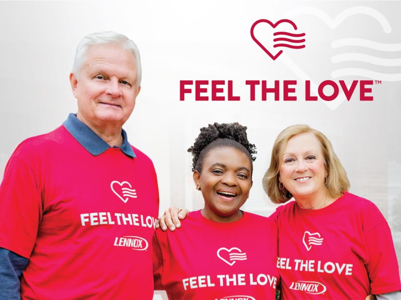 Three people next to each other wearing feel the love shirts