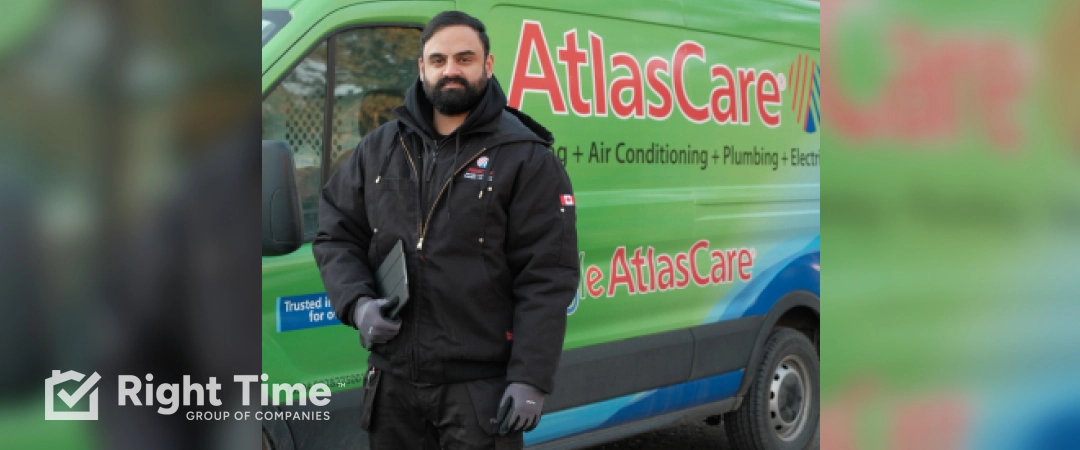 A technician stands beside an AtlasCare service van, ready to help with heating during cold weather in the GTA.