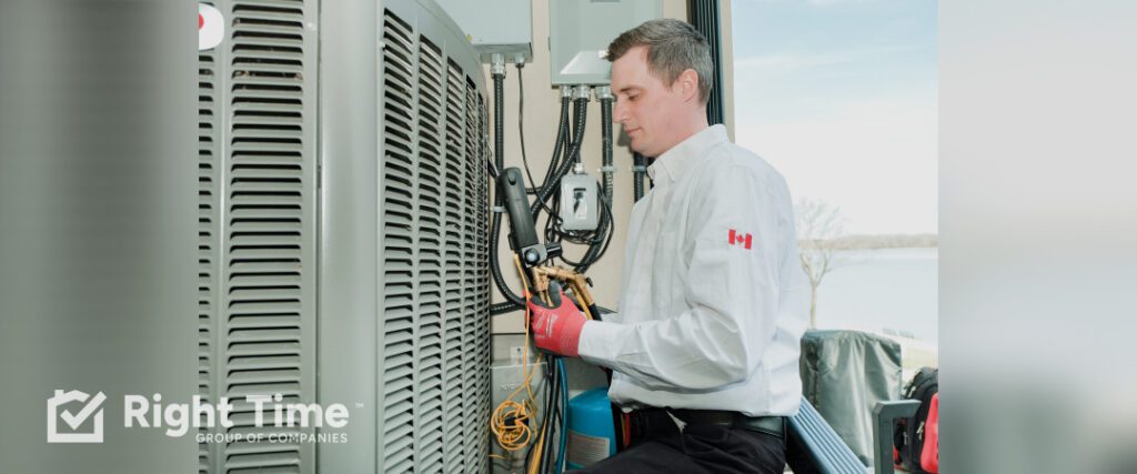 HVAC technician connecting refrigerant gauges to an outdoor central air conditioner during an R-22 system inspection and cooling service in Oakville.